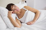 Attractive woman sleeping in bed