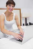 Smiling woman on the laptop