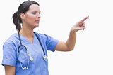 Female surgeon pointing at invisible screen