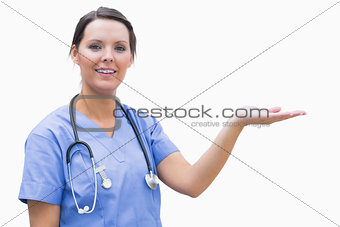 Portrait of female surgeon holding out open palm