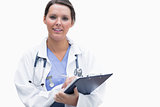 Portrait of smiling female doctor with clipboard