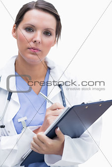 Portrait of female doctor with clipboard