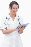 Young nurse using digital tablet