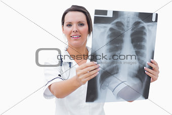 Portrait of young female nurse with xray
