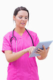 Young nurse using digital tablet
