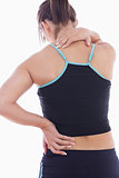 Rear view of sporty young woman massaging neck