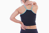 Rear view of sporty young woman massaging neck