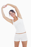 Portrait of smiling woman in sportswear holding hands up together