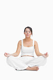 Young woman sitting in lotus position