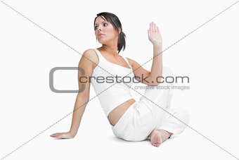 Young woman sitting in yoga position
