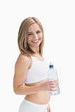 Portrait of happy young woman with water bottle