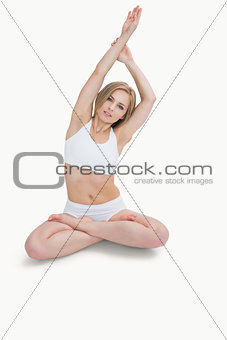 Portrait of young woman stretching hands