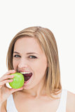 Closeup portrait of woman eating green apple
