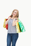 Portrait of cute young woman with shopping bags