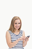 Portrait of casual young woman with smartphone