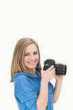 Portrait of happy female photographer with photographic camera