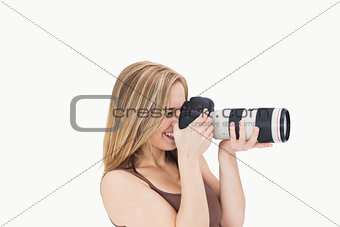 Side view of happy photographer with photographic camera