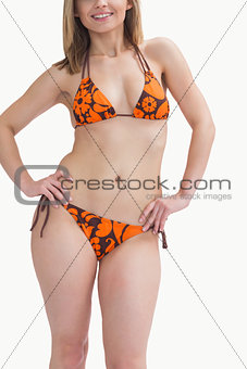 Happy young woman posing in bikini