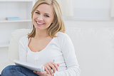 Portrait of happy woman with notepad at home