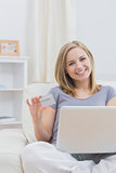 Portrait of casual woman doing online shopping at home