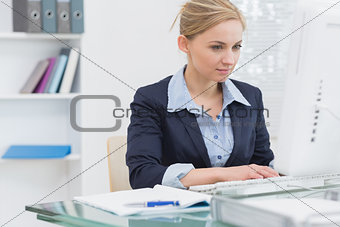 Business woman working on computer at office