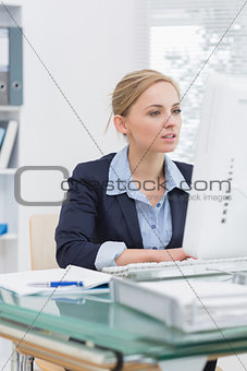 Business woman working on computer at office