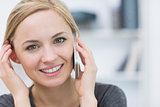 Closeup of smiling business woman using mobile phone