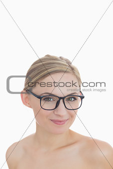 Closeup portrait of happy young woman wearing glasses