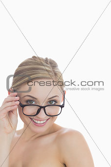 Closeup portrait of cheerful young woman wearing glasses