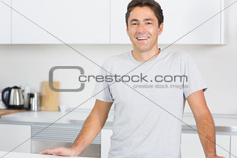 Smiling man in kitchen