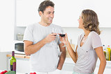Couple toasting with red wine