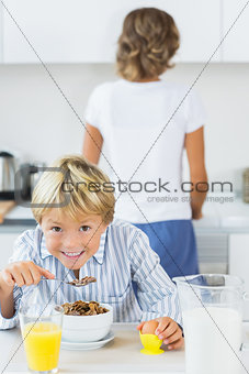 Happy boy having breakfast