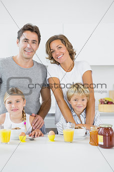 Smiling family at breakfast