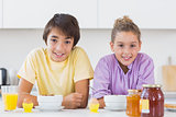 Siblings having breakfast