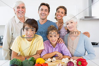 All the family smiling in kitchen