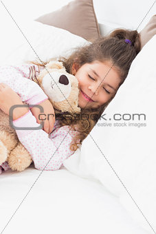 Little girl asleep with teddy