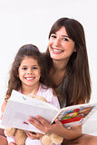 Mother and daughter reading storybook