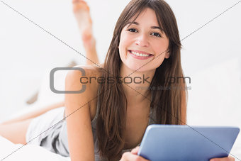 Happy woman with tablet pc