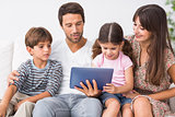 Happy family looking at tablet pc