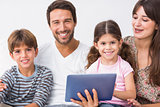 Happy family with tablet pc