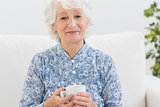 Elderly smiling woman looking at camera