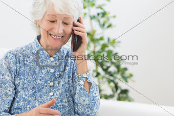 Elderly happy woman calling someone