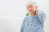 Elderly woman having a neck pain