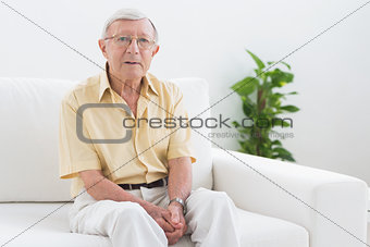 Elderly man looking at camera
