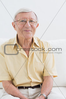 Smiling elderly man looking at camera