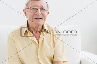 Cheerful elderly man looking at camera
