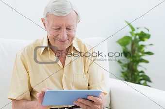 Elderly man using a digital tablet