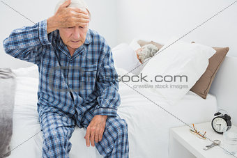 Elderly man suffering with head pain