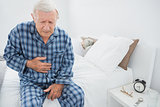 Aged man suffering with belly pain