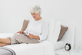 Elderly woman using a digital tablet
